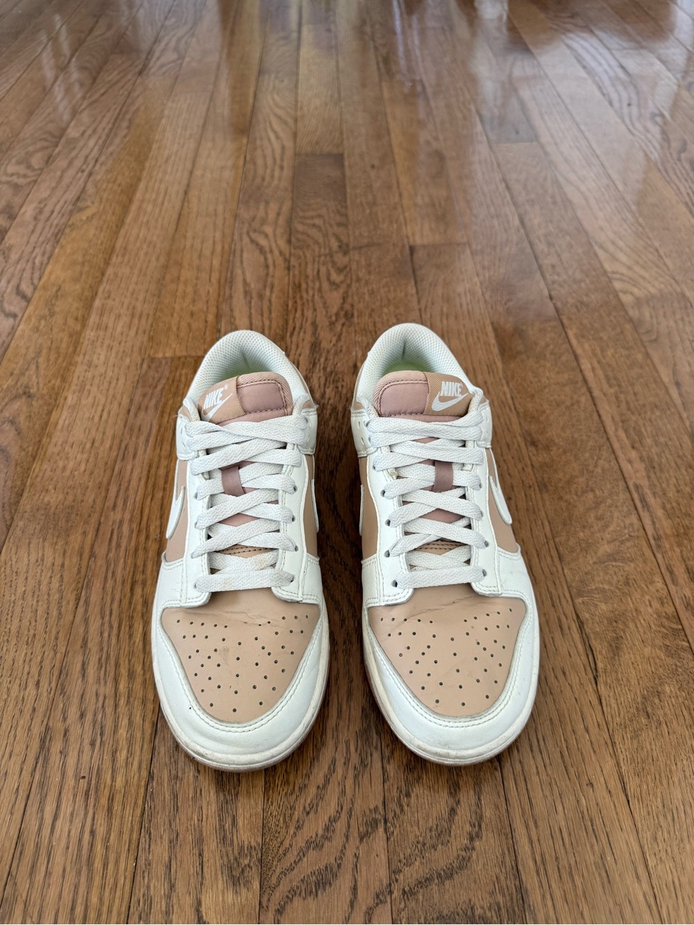 Nike Women’s Dunk Low Sneakers in Beige and White